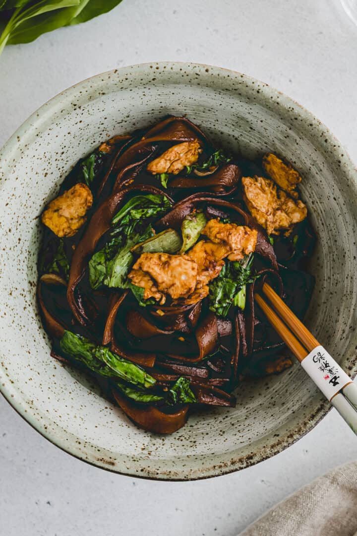 pad see ew noodles with bok choy in a bowl
