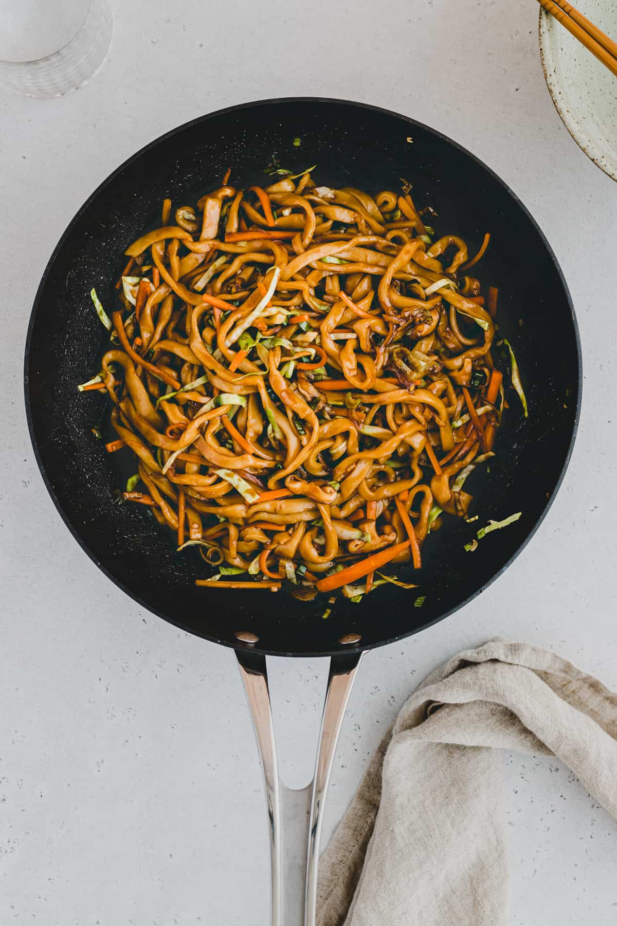 vegan yaki udon in a wok