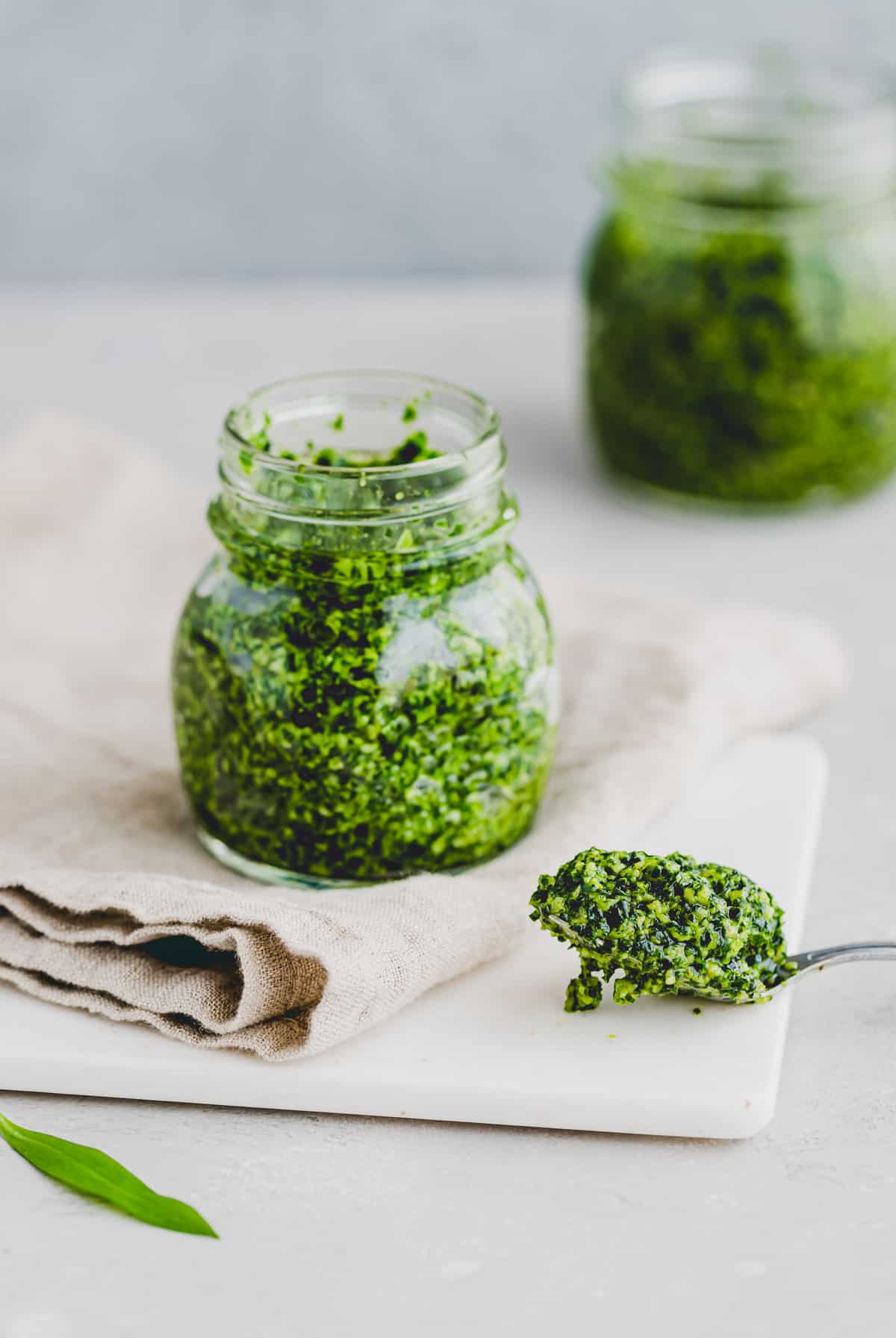 a spoon with fresh wild garlic pesto