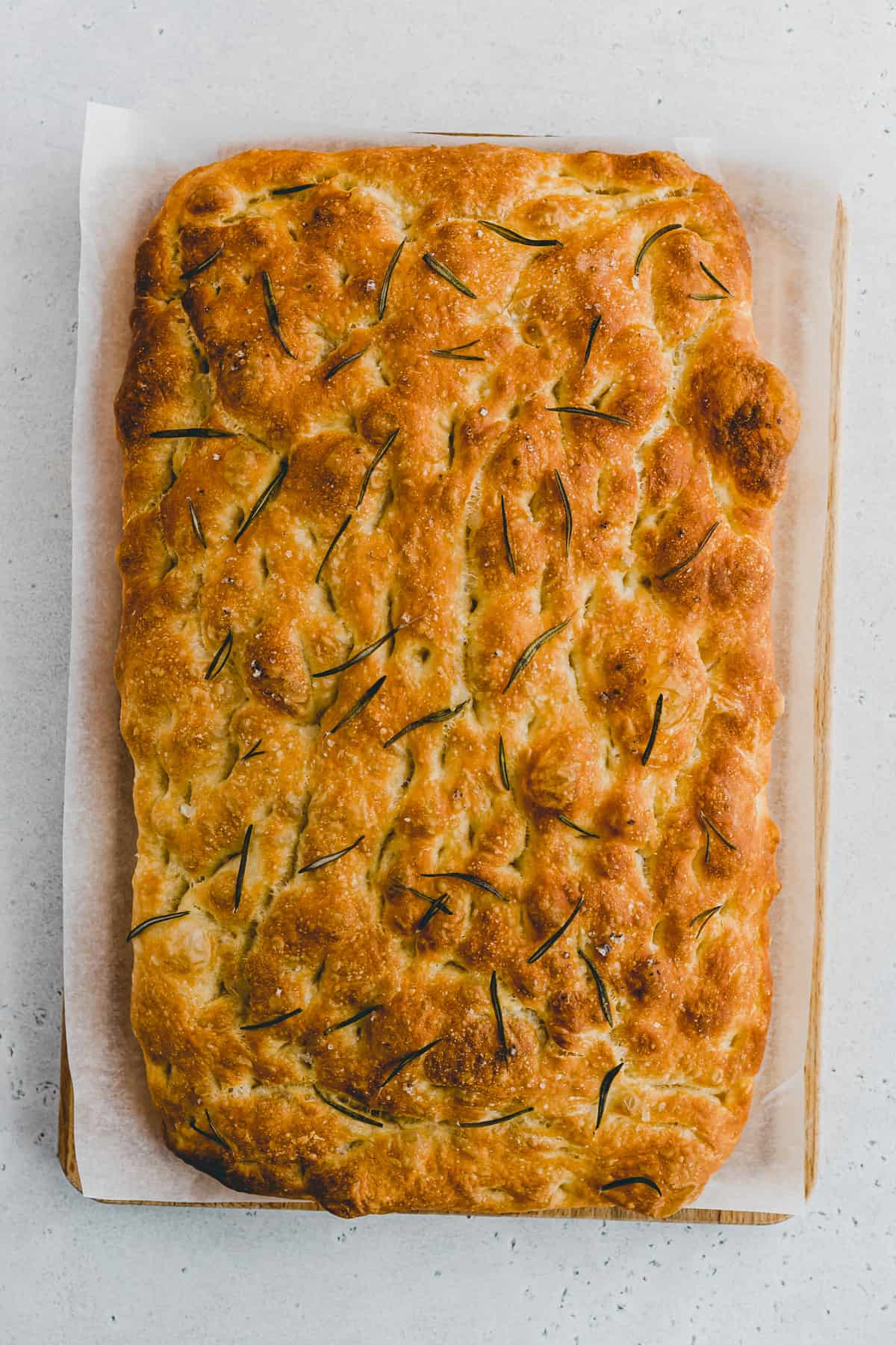 Top view of baked rosemary no knead focaccia bread.
