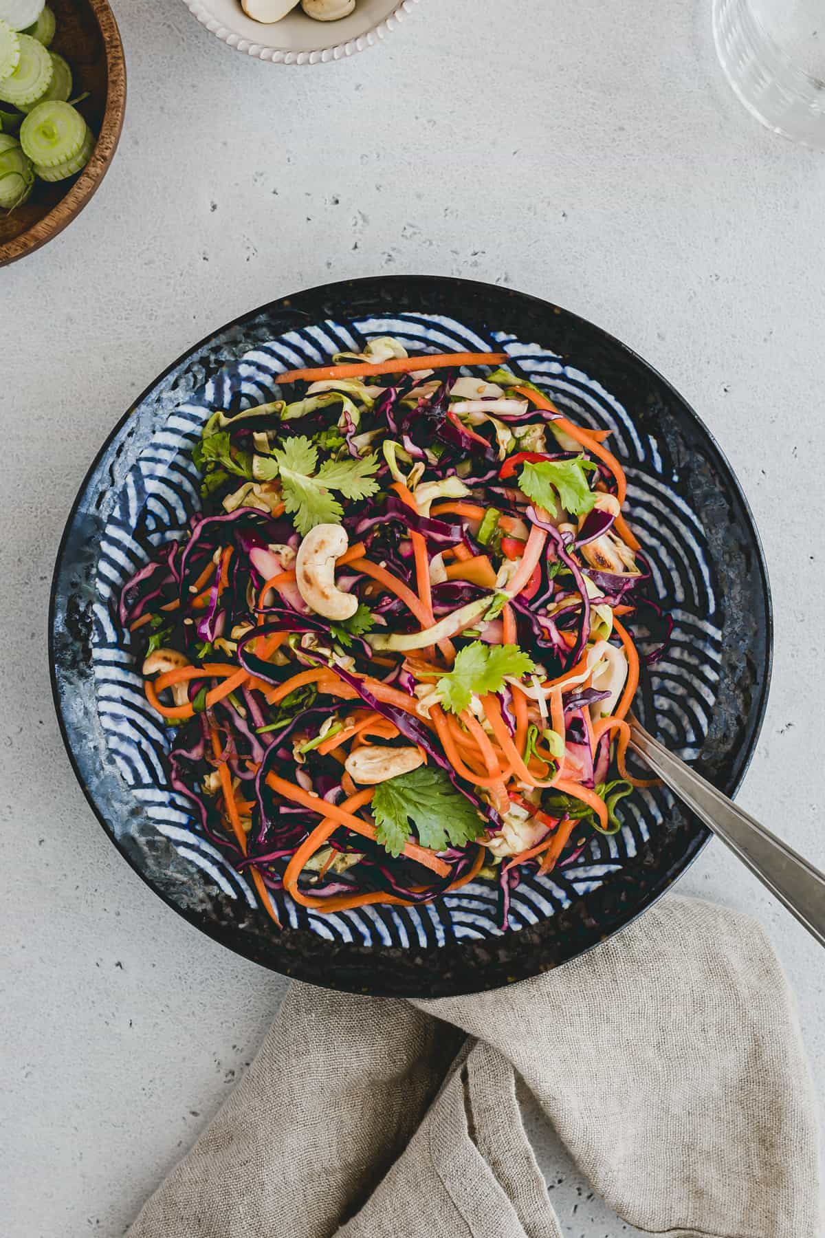 asian cole slaw salad on a blue plate