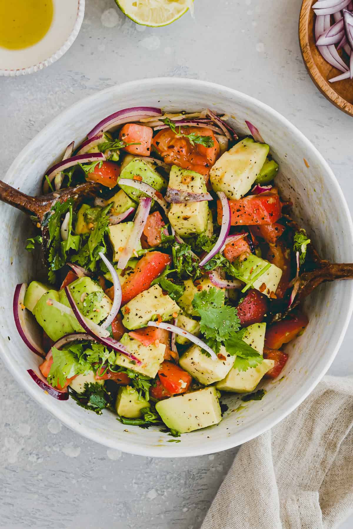 avocado tomato salad in a white salad bowl