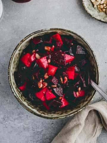 beet and apple salad with cashew nuts in a bowl