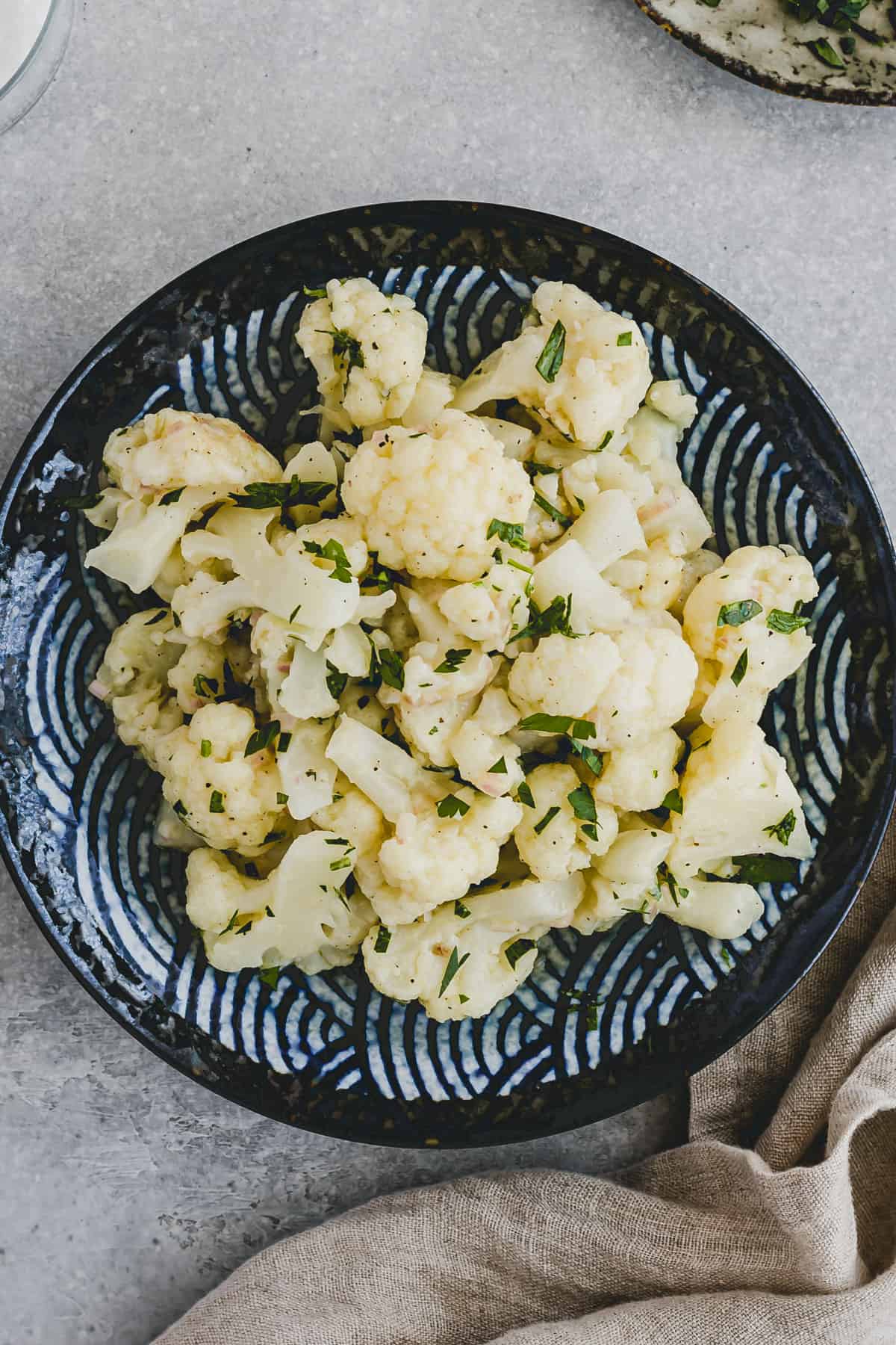 cooked cauliflower salad on a blue plate