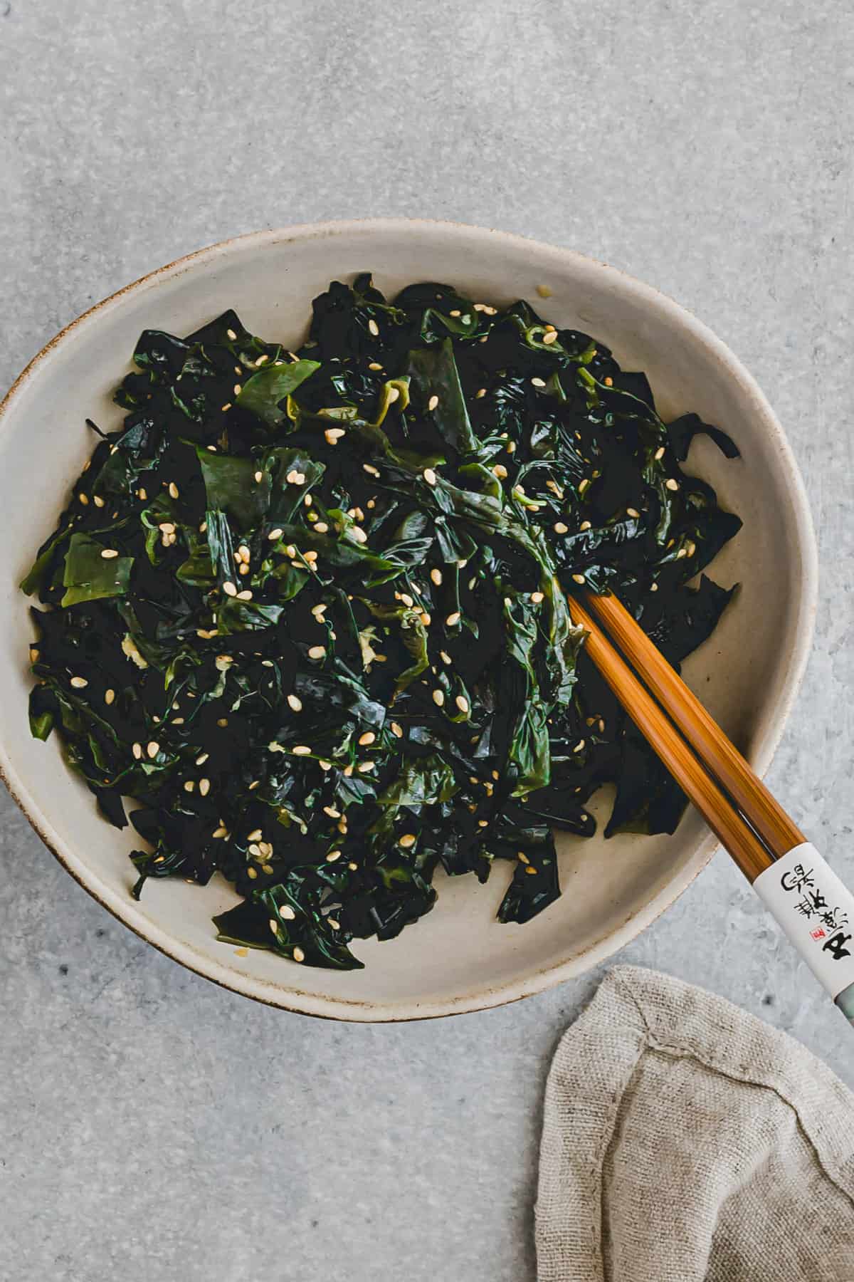 dried wakame salad in a bowl with chopsticks