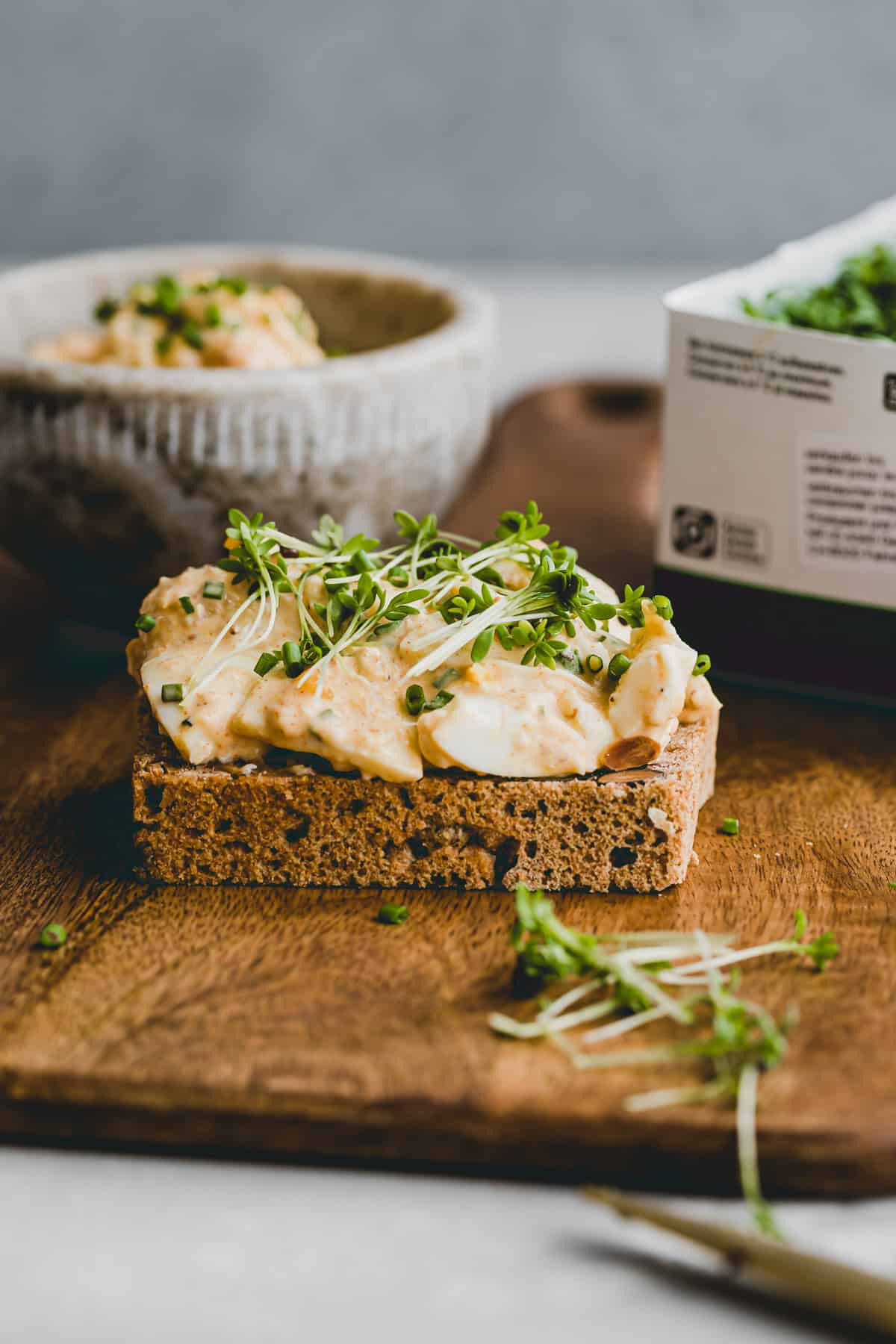 a slice of bread topped with egg salad