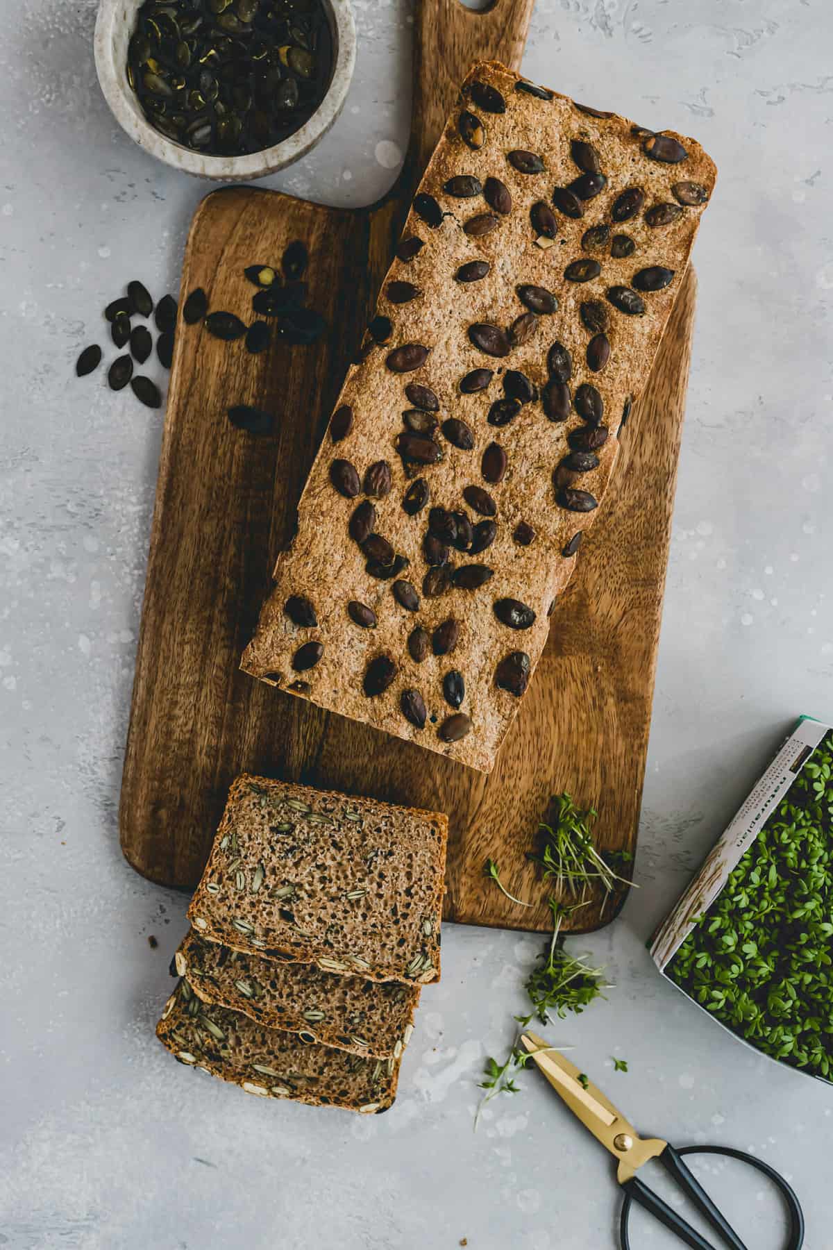pumpkin seed bread on a wooden board