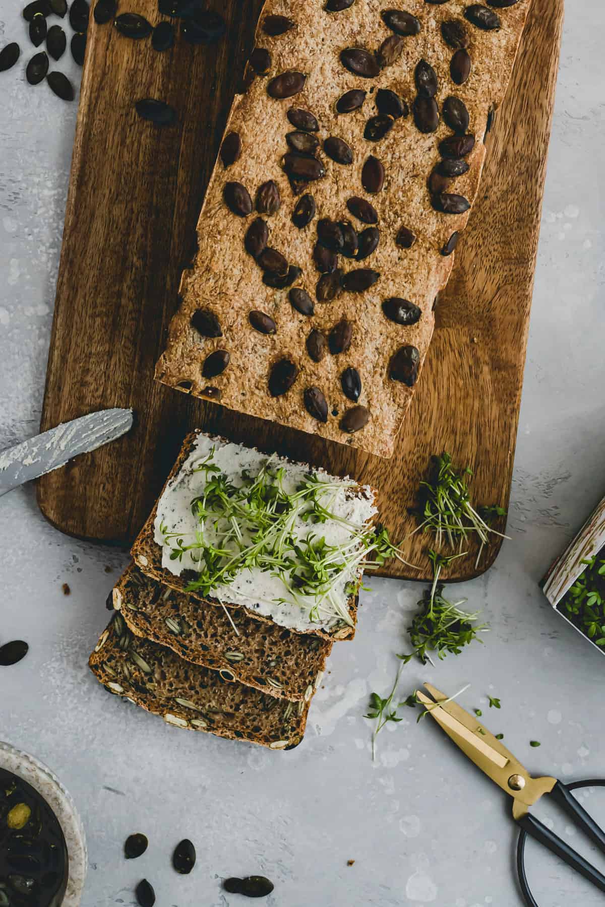 Pumpkin Seed Bread with cashew cream cheese and microgreens
