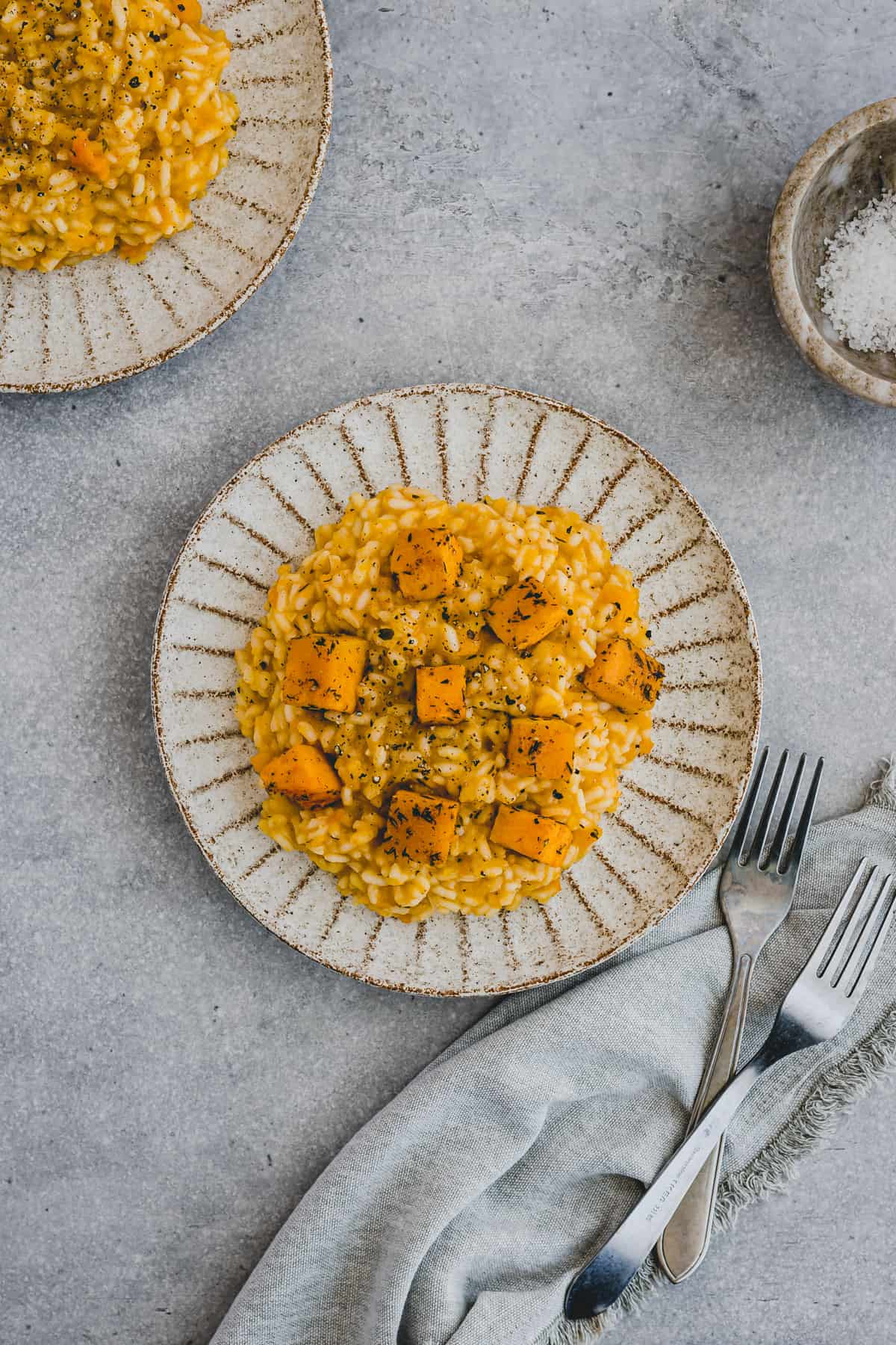 pumpkin risotto with roasted butternut squash on a plate