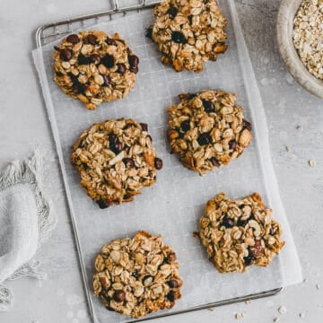 healthy banana oatmeal chocolate chip cookies on a wire rack