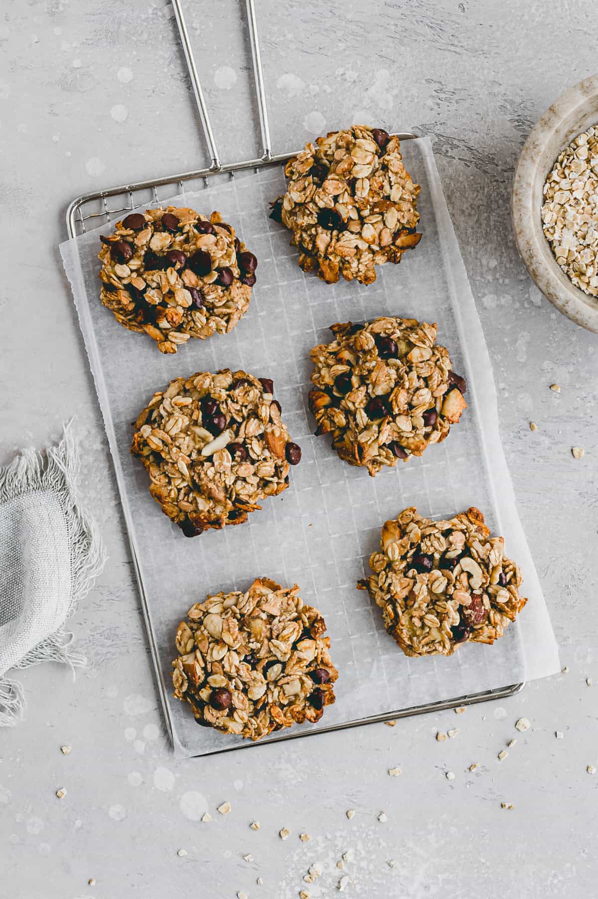 healthy banana oatmeal chocolate chip cookies on a wire rack