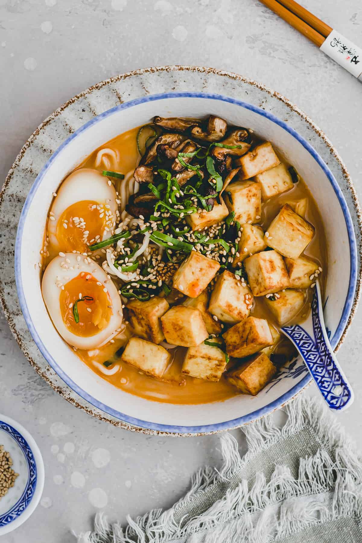 ramen eggs served on a bowl of ramen soup