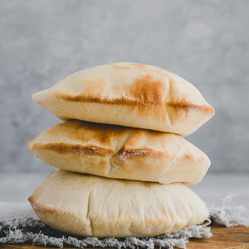 a stack of homemade pita bread