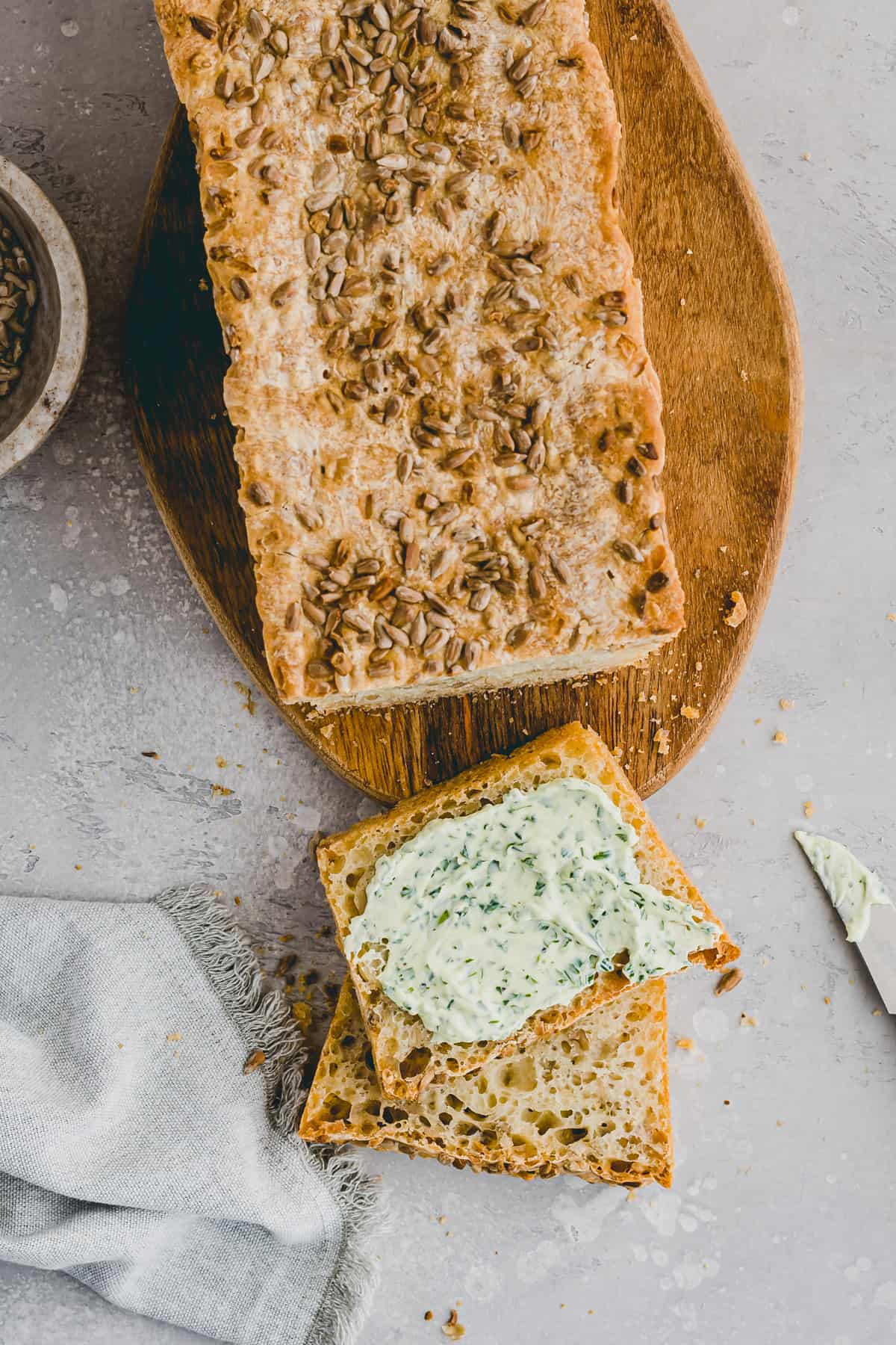 slices of homemade Sunflower Seed Bread spread with cream cheese