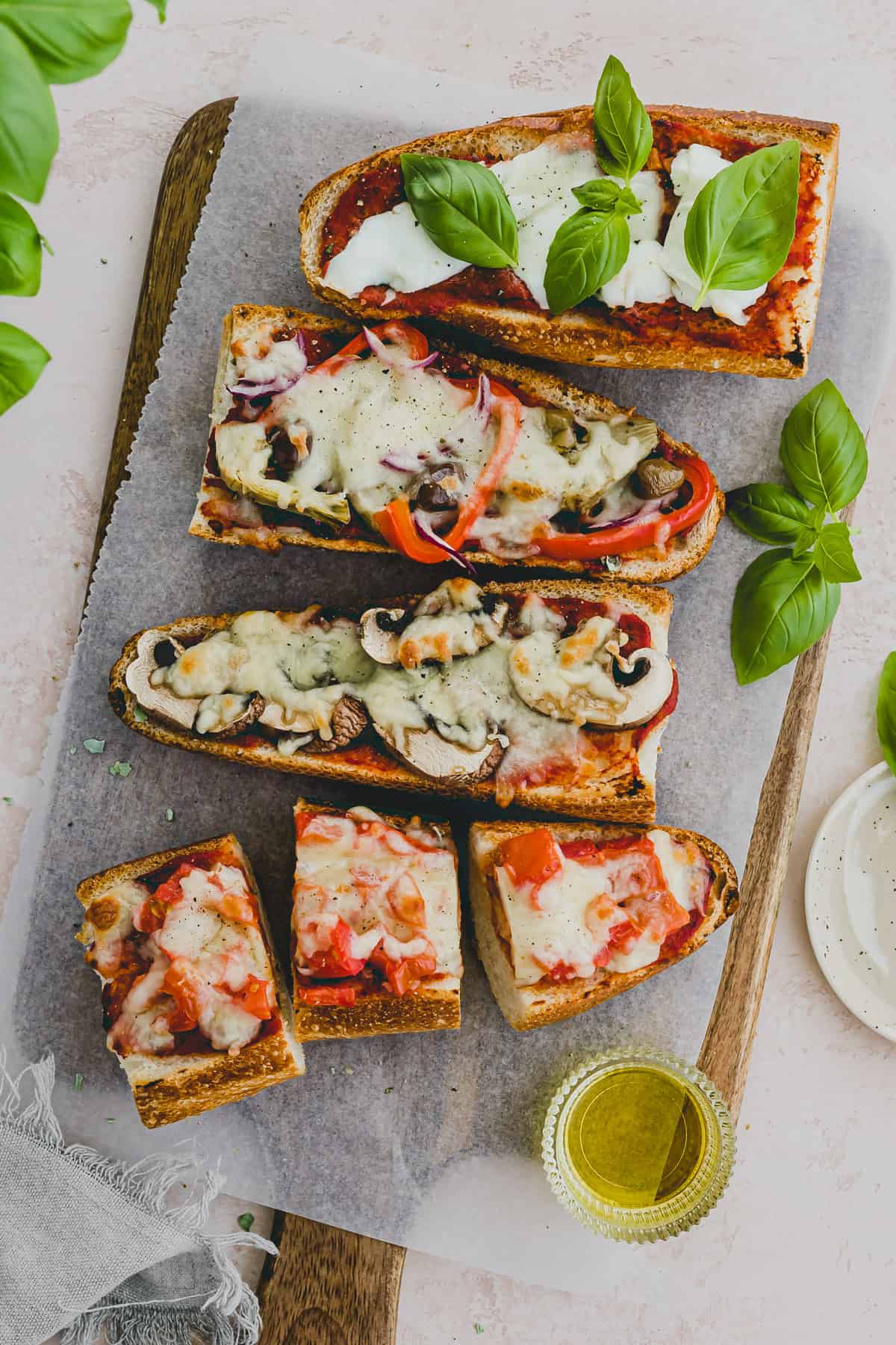 french bread pizza served on a wooden platter