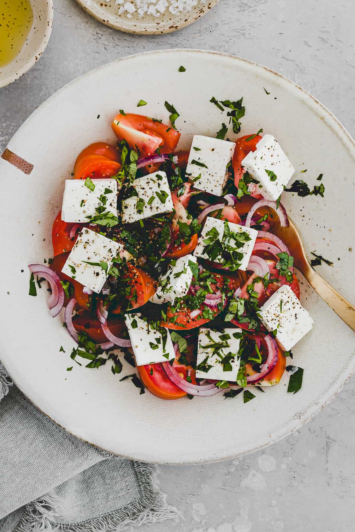 tomato feta salad served on a plate