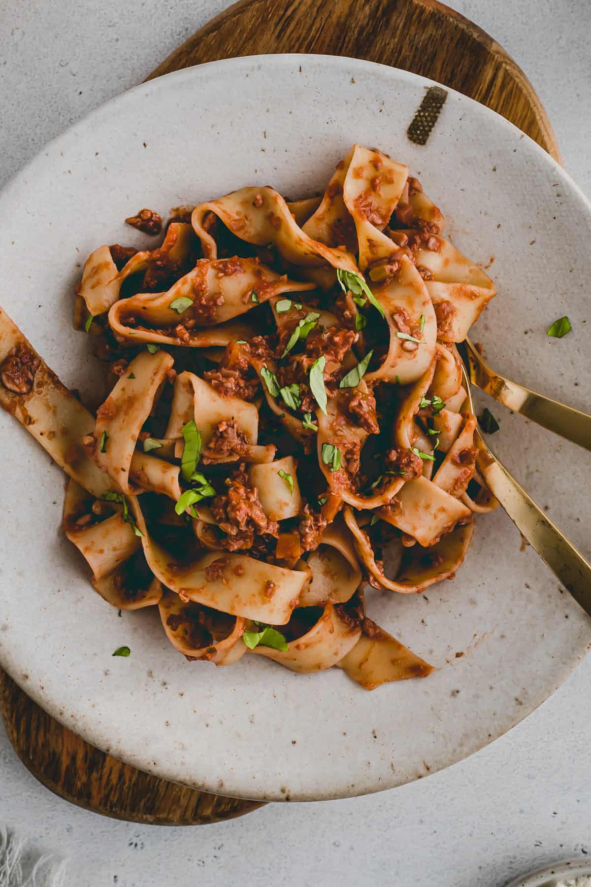 vegan mushroom bolognese with walnuts in a pasta plate