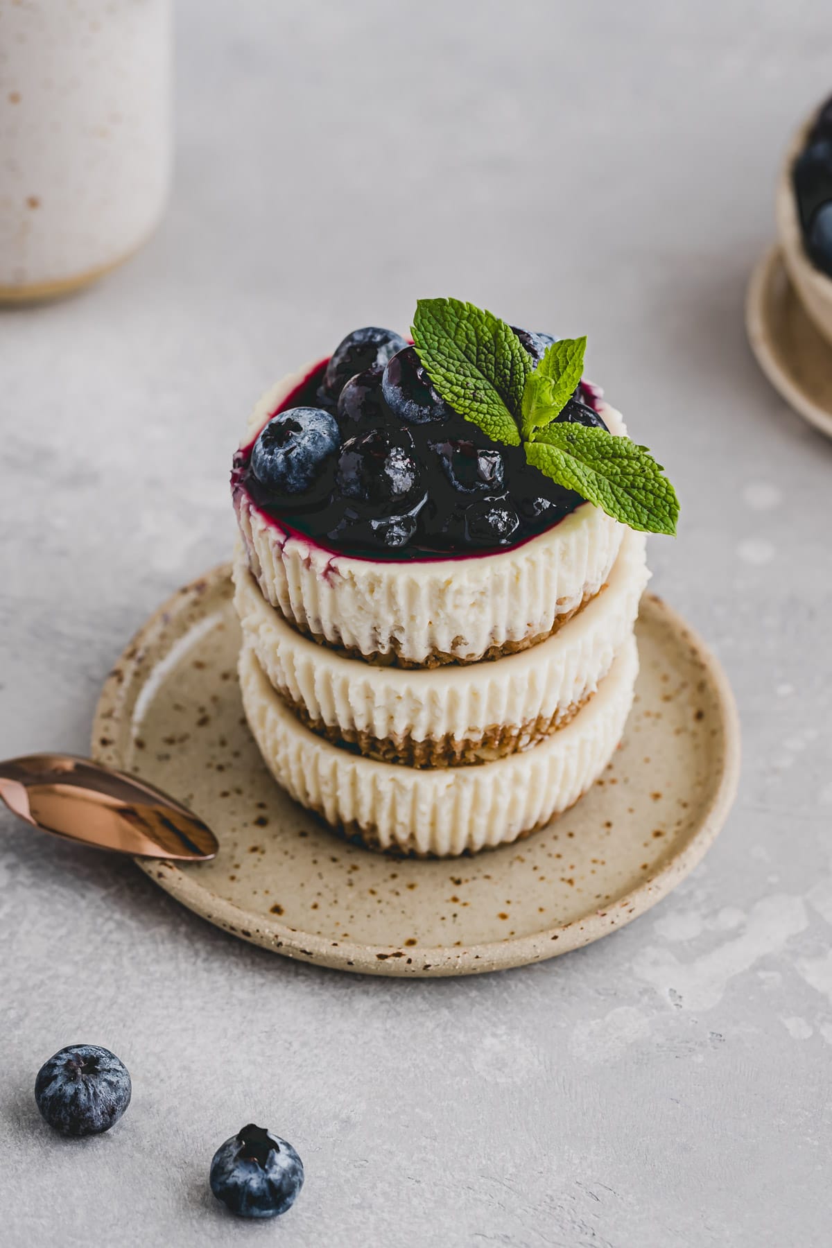 mini cheesecake bites topped with blueberries