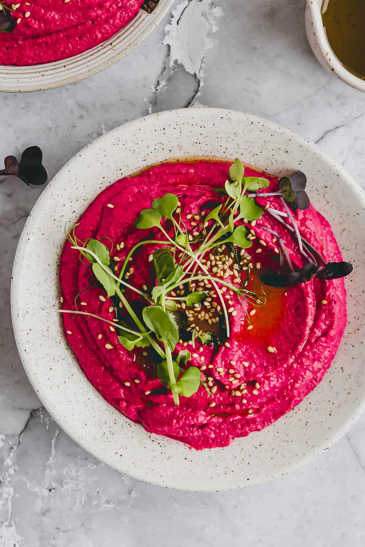 a bowl with beet hummus