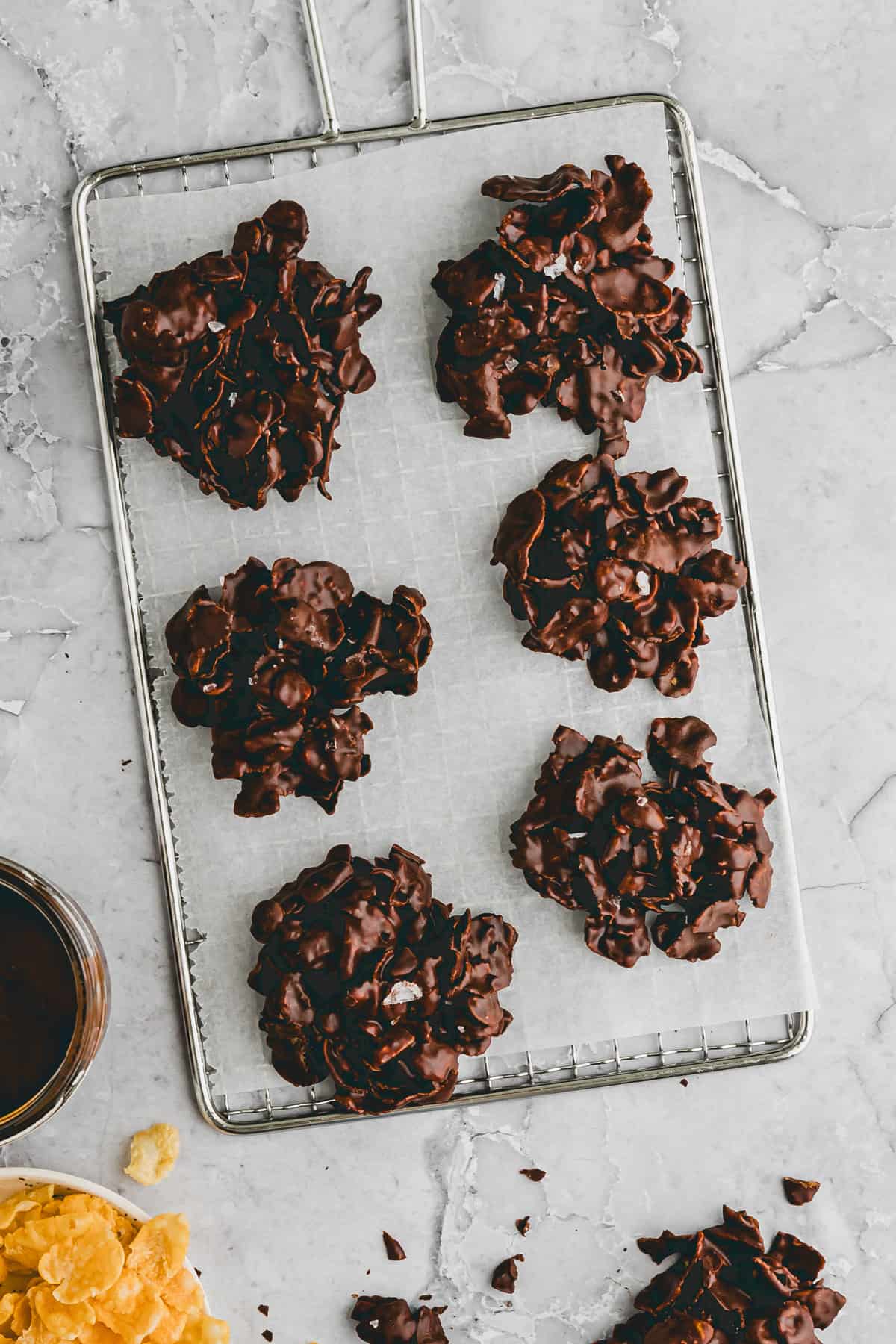 covered chocolate corn flakes cakes on a wire rack