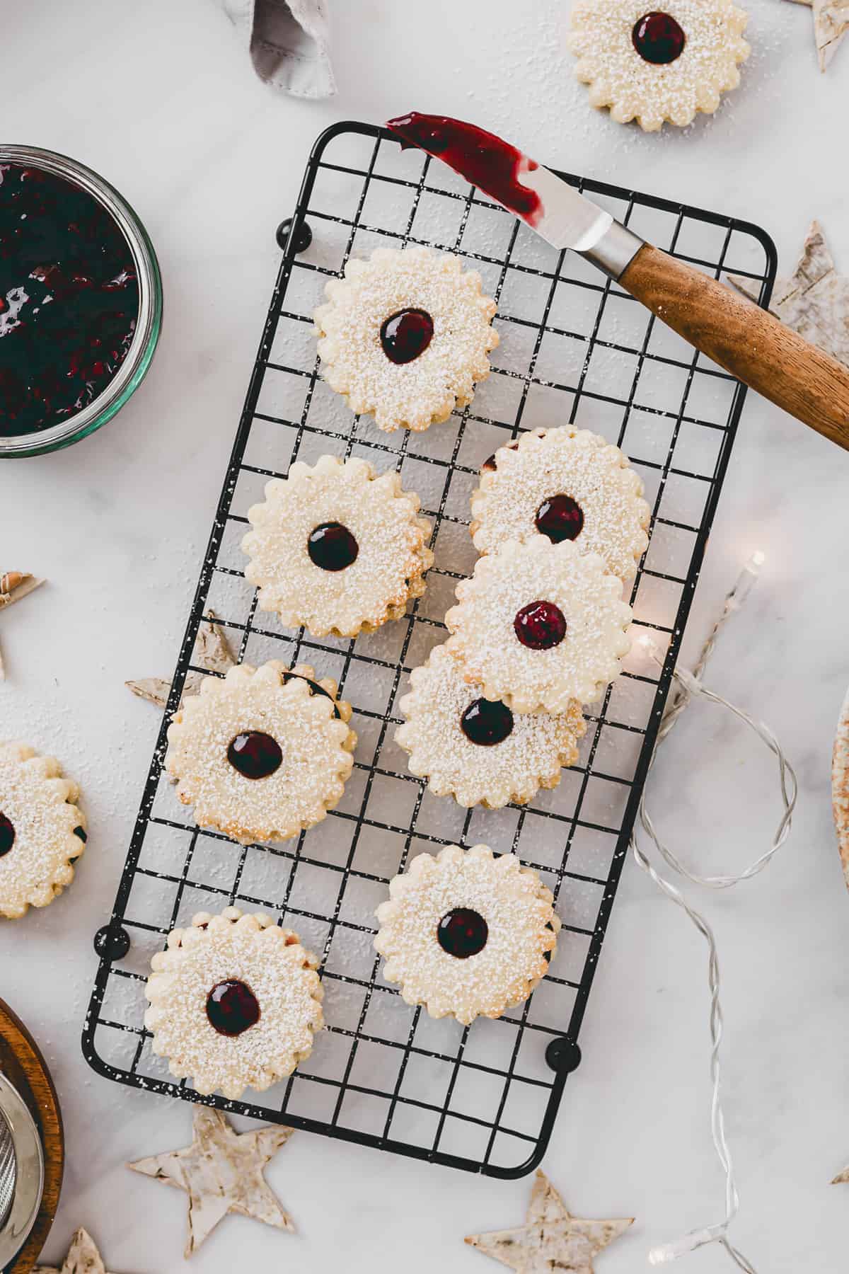 linzer cookies on a wire rack