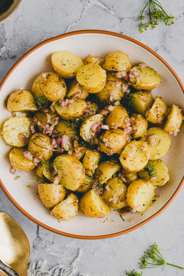 vegan german potato salad with dill in a plate
