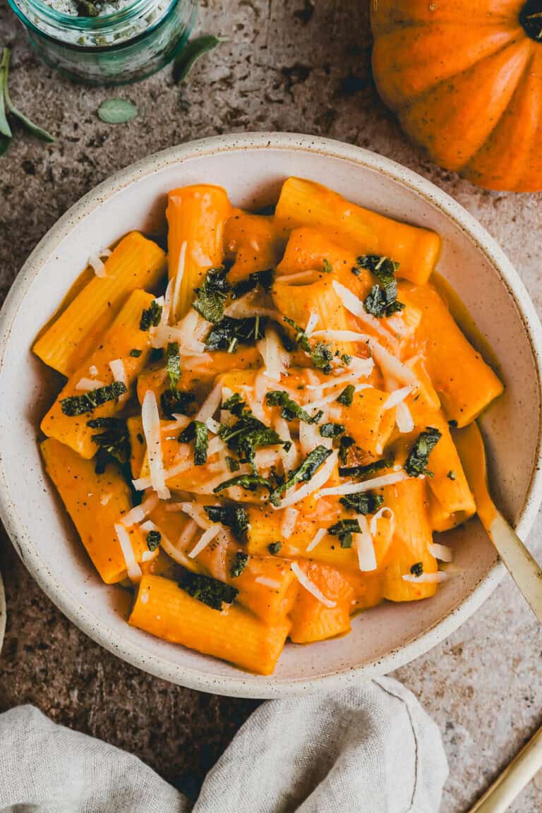 creamy pumpkin pasta topped with crispy chopped sage leaves