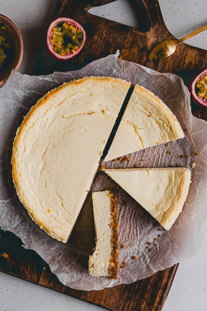 cottage cheese cheesecake sliced on a wooden board