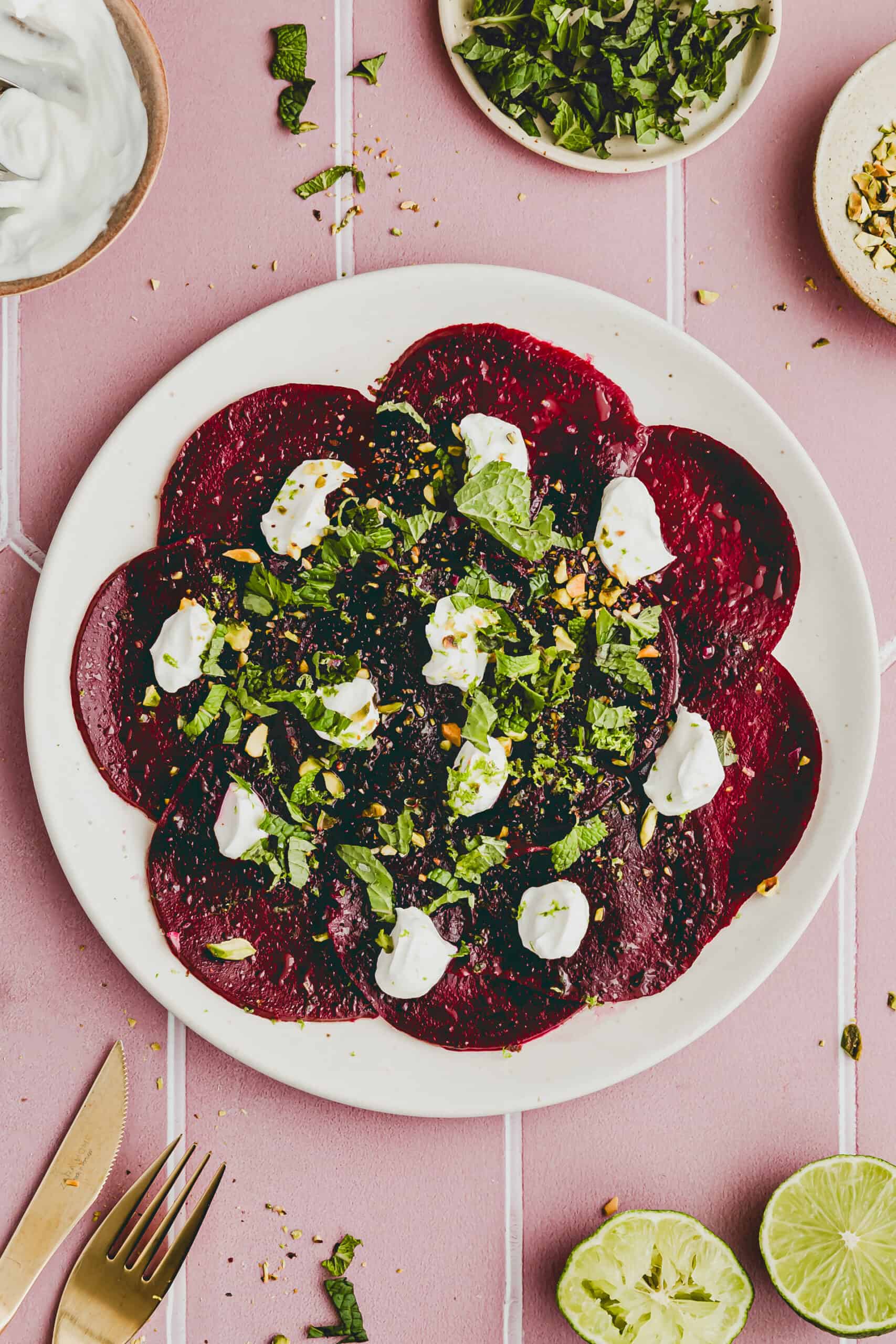 beet carpaccio with goat cheese on a serving platter