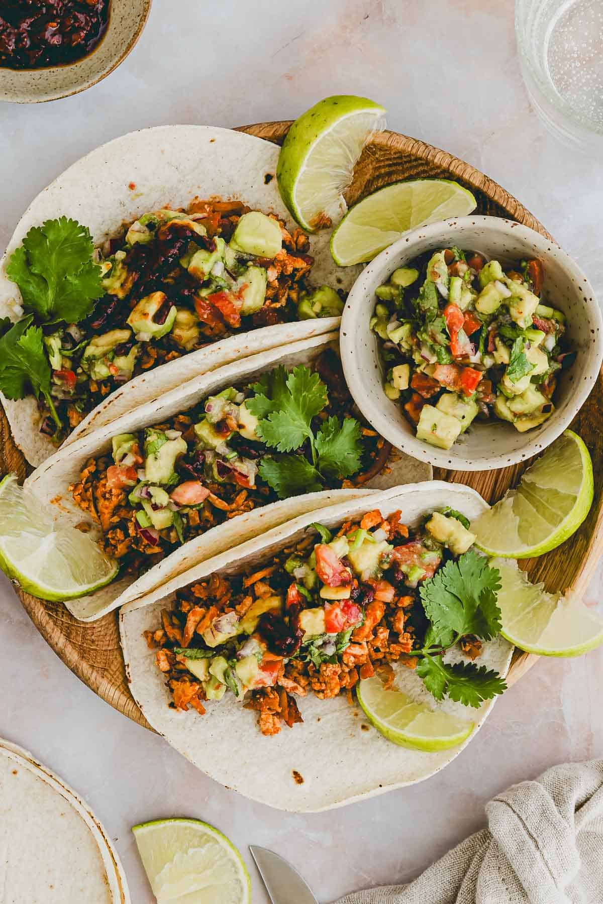 shredded tofu tacos served on a plate