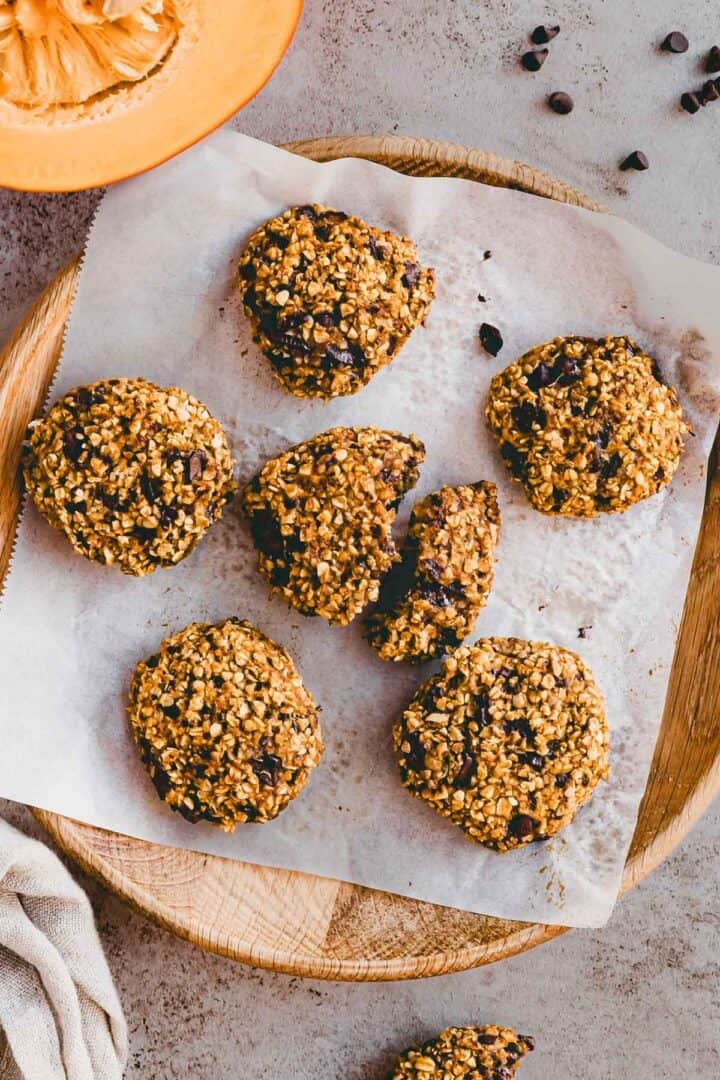 healthy Pumpkin Chocolate Chip Oatmeal Cookies on a wooden plate